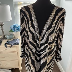 Womens zebra knit tunic with big gold zipper. Metallic gold finish. 3/4 sleeves.